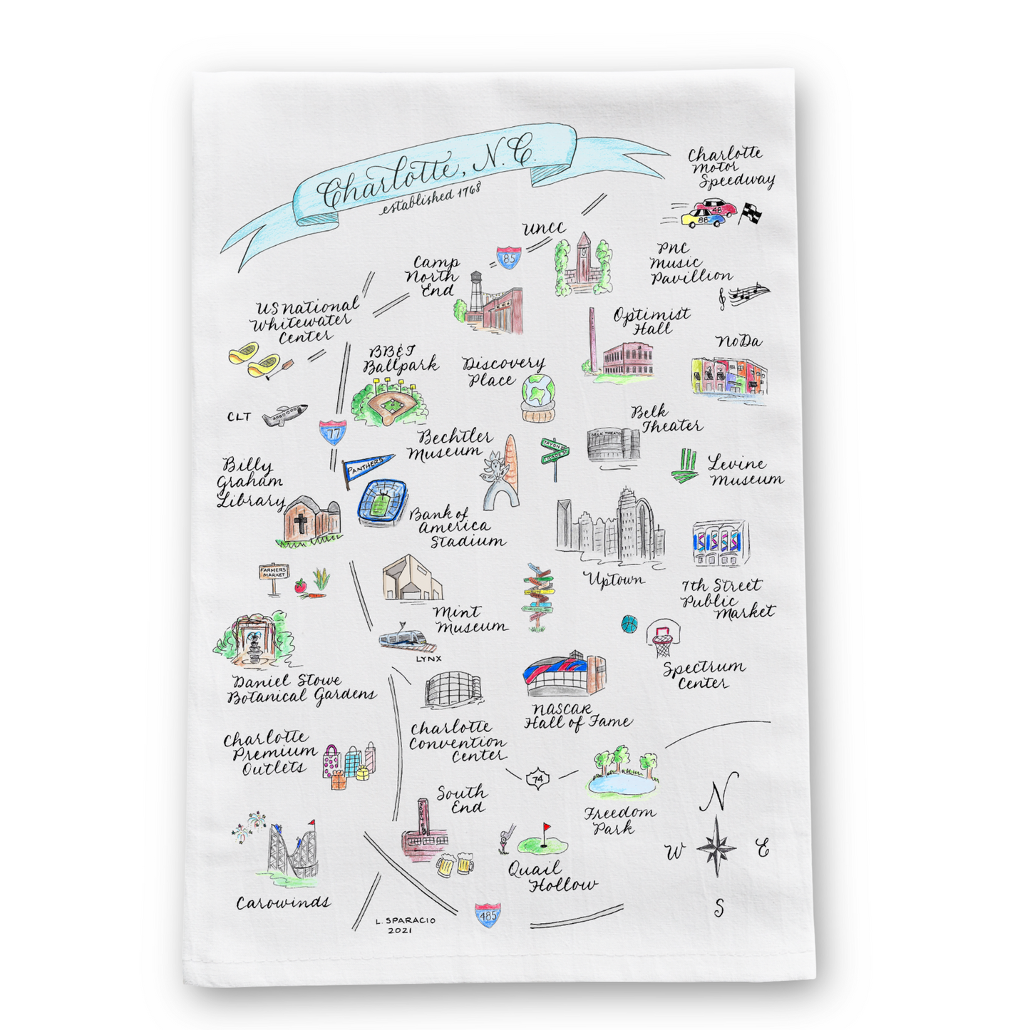 A white cotton tea towel with a hand-lettered print of a hand-calligraphed map of Charlotte, NC, featuring various streets and landmarks.