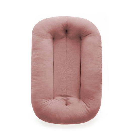 Snuggle me organic infant lounger in gumdrop pink.